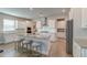 Modern kitchen featuring white cabinets, granite countertops, stainless steel appliances, and island seating at 146 Stagecoach Ave, Summerville, SC 29486