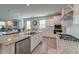 Gourmet kitchen featuring granite counters, stainless steel appliances, and an open floor plan at 146 Stagecoach Ave, Summerville, SC 29486