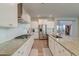 Modern kitchen boasts granite countertops, stainless steel appliances, and white cabinets at 146 Stagecoach Ave, Summerville, SC 29486