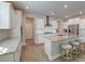 Bright kitchen features granite counters, stainless appliances, a large island with seating, and modern fixtures at 146 Stagecoach Ave, Summerville, SC 29486