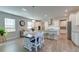 Open-concept kitchen with granite countertops, white cabinets, and an island with seating at 146 Stagecoach Ave, Summerville, SC 29486