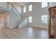 Living area with high ceilings, staircase, and lots of natural light at 146 Stagecoach Ave, Summerville, SC 29486