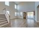 Inviting living room boasting soaring ceilings, large windows, and hardwood floors at 146 Stagecoach Ave, Summerville, SC 29486