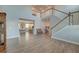 Spacious living room with an open floor plan, hardwood floors, and staircase at 146 Stagecoach Ave, Summerville, SC 29486