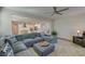 Spacious living room with a plush sectional sofa, ceiling fan, and view of the kitchen at 146 Stagecoach Ave, Summerville, SC 29486
