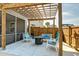 Relax on the outdoor patio beneath the pergola with comfortable seating and a fire pit at 146 Stagecoach Ave, Summerville, SC 29486
