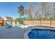 Sparkling pool with lounge chairs and a well-maintained backyard fence at 146 Stagecoach Ave, Summerville, SC 29486
