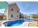 Lovely swimming pool in the backyard with a screened-in porch and outdoor dining area at 146 Stagecoach Ave, Summerville, SC 29486
