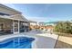 Inviting backyard pool area with lounge seating, pergola, and screened porch perfect for relaxation at 146 Stagecoach Ave, Summerville, SC 29486
