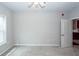 Bright bedroom with neutral walls, ceiling fan, and plush gray carpeting creating a cozy atmosphere at 1755 Central Park Rd # 5107, Charleston, SC 29412