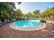 Tranquil community pool area with comfortable lounge chairs and shaded pergola at 1755 Central Park Rd # 5107, Charleston, SC 29412