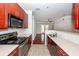 Open kitchen leading into the living room, complete with modern appliances and stylish counters at 1755 Central Park Rd # 5107, Charleston, SC 29412