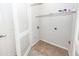 This functional laundry area provides convenient shelving and ample space for a washer and dryer at 1755 Central Park Rd # 5107, Charleston, SC 29412