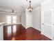 Bright living room featuring hardwood floors and modern light fixtures, creating a welcoming space at 1755 Central Park Rd # 5107, Charleston, SC 29412