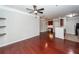 Hardwood floors flow through the living area into the kitchen, complemented by modern lighting at 1755 Central Park Rd # 5107, Charleston, SC 29412