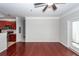 Living area showcasing hardwood floors flowing into an adjacent kitchen with contemporary finishes at 1755 Central Park Rd # 5107, Charleston, SC 29412