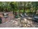 Outdoor brick grill area with lounge chairs, perfect for relaxing and entertaining at 1755 Central Park Rd # 5107, Charleston, SC 29412