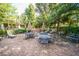 Inviting outdoor patio with brick pavers, umbrella tables, and lush greenery at 1755 Central Park Rd # 5107, Charleston, SC 29412