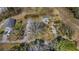 Aerial view of the property with ample parking and a unique tree in the front yard at 1812 Burgess St, Charleston, SC 29412