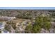 Expansive aerial view of the real estate and surrounding nature, with some houses nearby at 1812 Burgess St, Charleston, SC 29412