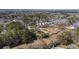 Scenic aerial view of a neighborhood nestled amongst trees and foliage, showing rooftops and greenery at 1812 Burgess St, Charleston, SC 29412
