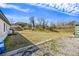 Spacious backyard with gravel and patchy grass, ready for landscaping and outdoor activities at 1812 Burgess St, Charleston, SC 29412