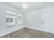 Bedroom with carpet floors, white ceiling fan, and two windows offering ample natural light at 2002 Stonebraker Ln, Hanahan, SC 29410