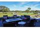 Comfortable patio with modern outdoor furniture and views of a lush green golf course at 2017 Long Bend Dr, Seabrook Island, SC 29455