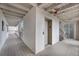 Hallway view featuring an elevator in a building with a white-painted interior and wooden floors at 2017 Long Bend Dr, Seabrook Island, SC 29455