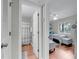 Hallway view of the guest bedroom and bathroom with a modern design aesthetic at 2017 Long Bend Dr, Seabrook Island, SC 29455