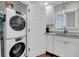 Functional laundry area featuring a stackable washer and dryer at 2017 Long Bend Dr, Seabrook Island, SC 29455