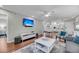 Open concept living area with TV, dining table, and adjacent kitchen at 2017 Long Bend Dr, Seabrook Island, SC 29455