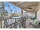 Relaxing porch area with a dining table and seating, with scenic outdoor views at 2017 Long Bend Dr, Seabrook Island, SC 29455