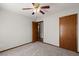 Carpeted bedroom with a ceiling fan, neutral walls, and wood trim at 204 Tram Blvd, Summerville, SC 29486
