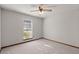 Spacious carpeted bedroom featuring a ceiling fan, window and neutral walls at 204 Tram Blvd, Summerville, SC 29486