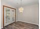 Elegant dining area with stylish chandelier and access to the outdoor space at 204 Tram Blvd, Summerville, SC 29486