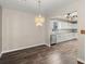 Dining area with stylish chandelier adjacent to a modern kitchen at 204 Tram Blvd, Summerville, SC 29486
