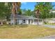 Inviting single-story home with a well-maintained lawn and mature palm trees at 204 Tram Blvd, Summerville, SC 29486