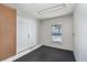 View of the garage with black floors, double doors, and peg board at 204 Tram Blvd, Summerville, SC 29486