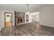 Spacious living room featuring a stone fireplace, ceiling fan, and hardwood floors at 204 Tram Blvd, Summerville, SC 29486