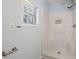 Shower stall featuring a built in seat and shelving with a window allowing natural light at 204 Tram Blvd, Summerville, SC 29486