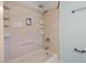 Close-up of a shower with installed shelving and a tan colored surround at 204 Tram Blvd, Summerville, SC 29486