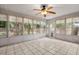 Bright sunroom with tile flooring, large windows offering views of the outdoors, and a ceiling fan at 204 Tram Blvd, Summerville, SC 29486