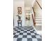 Bright foyer with black and white checkered floors and an adjacent staircase at 2045 Country Manor Dr, Mount Pleasant, SC 29466