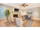 Bright living room featuring a fireplace, plush seating, and large windows at 2072 Middleburg Ln, Mount Pleasant, SC 29464