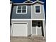 Two-story townhome with gray siding and a one-car garage at 2104 Scarlett Maple St, Summerville, SC 29486