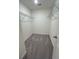 Well-organized walk-in closet with shelving and carpeted flooring at 2104 Scarlett Maple St, Summerville, SC 29486