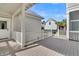 Inviting back porch with white railings, providing a view of the backyard at 213 Amberjack Ln, Charleston, SC 29492