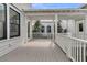 Inviting back porch area with white railing and plenty of space for entertaining and enjoying the outdoors at 213 Amberjack Ln, Charleston, SC 29492