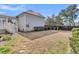 Large backyard of the home featuring a well-maintained lawn, offering ample space for outdoor activities at 213 Amberjack Ln, Charleston, SC 29492